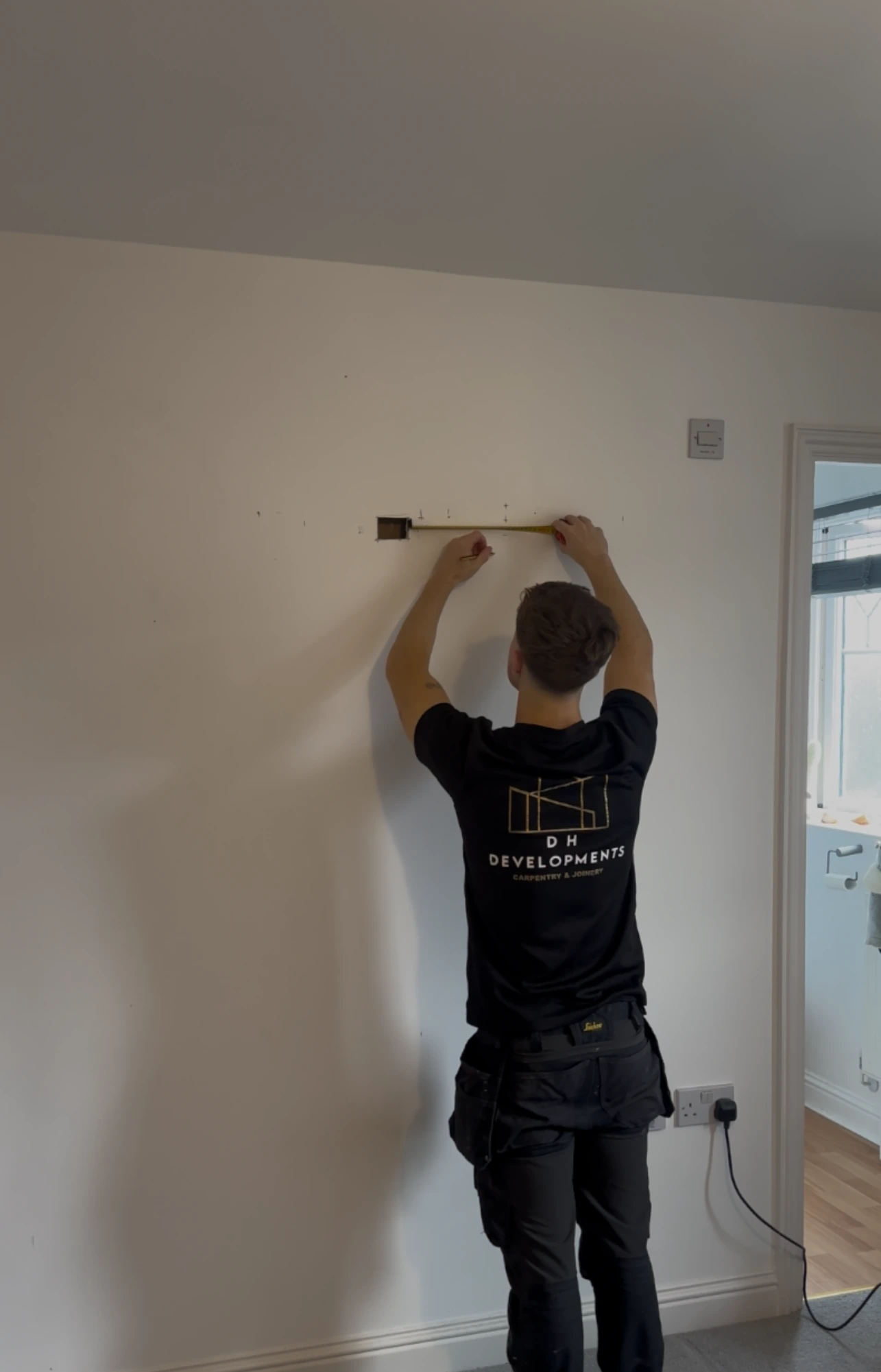 Dan from DH Developments carrying out carpentry work in a client's home